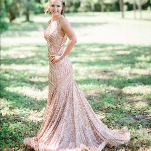 I am selling my senior prom dress. It is a size 4, rose gold Jovani dress!